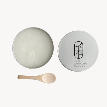 Body scrub with a wooden spoon on a white background