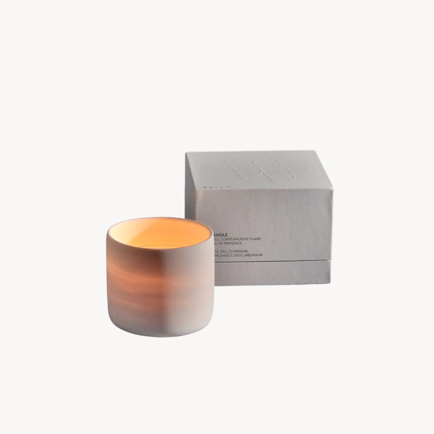 Cylindrical candle with gradient color and a gray box on a white background