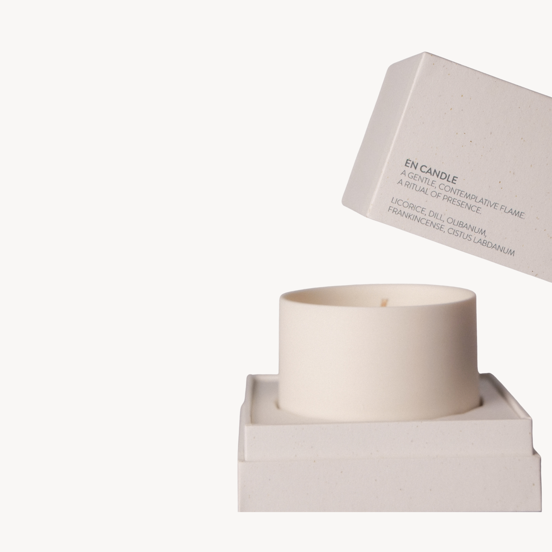White candle in a box with a white background